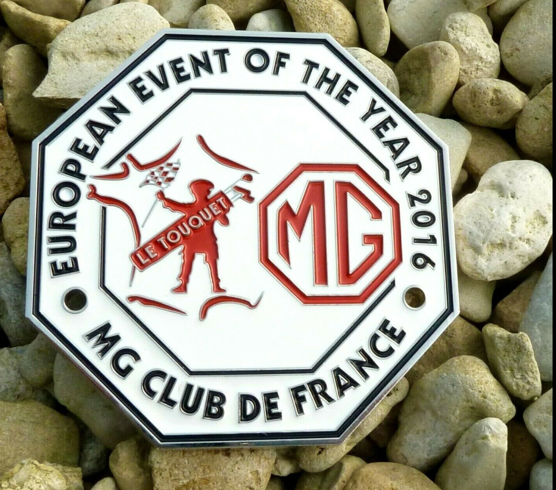 MG