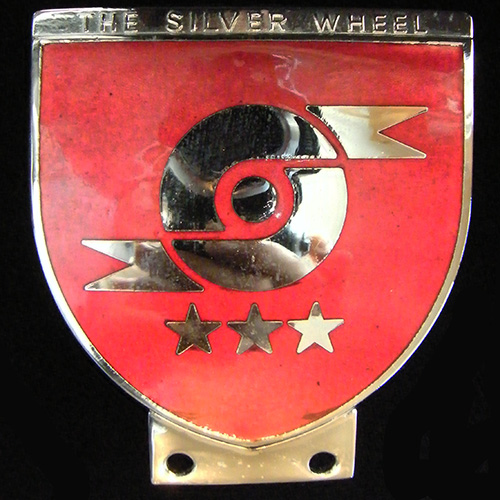 Silver Wheel (The) Car badge (Motor Cycle ?)