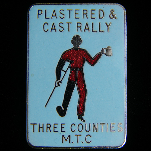 Plastered & Cast Rally pin badge