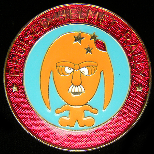 Bruised Helmet Rally pin badge